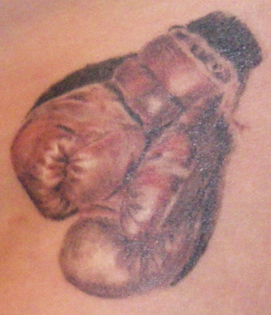 boxing glove tattoo. i see oxing gloves on the